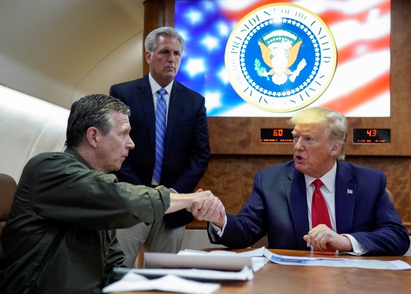 &copy; Reuters. FILE PHOTO: U.S. President Donald Trump receives a briefing on Hurricane Dorian recovery efforts aboard Air Force One in Havelock, North Carolina