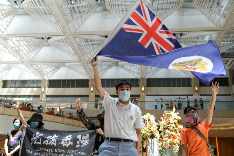 &copy; Reuters. A pro-democracy demonstrator waves the British colonial Hong Kong flag during a protest against new national security legislation in Hong Kong