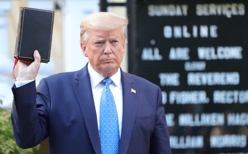 &copy; Reuters. U.S. President Trump holds up Bible during photo opp in front of St John&apos;s Church in Washington