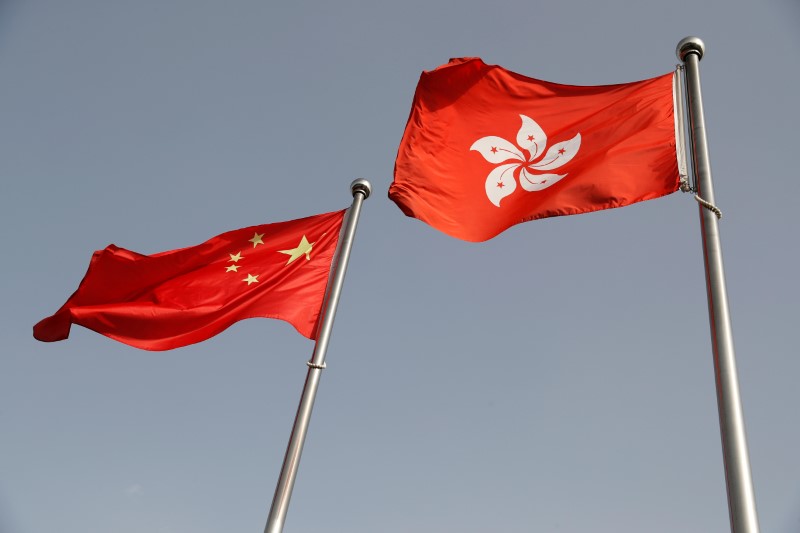 &copy; Reuters. The Chinese and Hong Kong flags flutter at the office of the Government of the Hong Kong Special Administrative Region, ahead of a news conference held by Hong Kong Chief Executive Carrie Lam, in Beijing