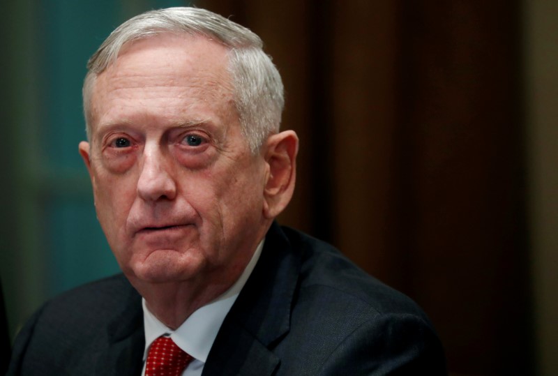 © Reuters. FILE PHOTO: U.S. Defense Secretary James Mattis listens as U.S. President Donald Trump speaks to the news media while gathering for a briefing from his senior military leaders in the Cabinet Room at the White House in Washington