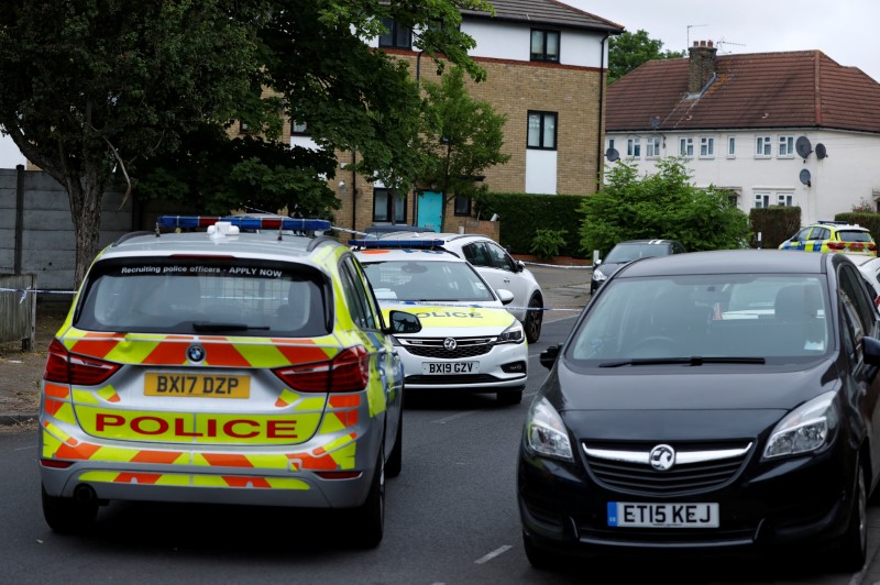 &copy; Reuters. Police cars block a street at the scene of a shooting in London