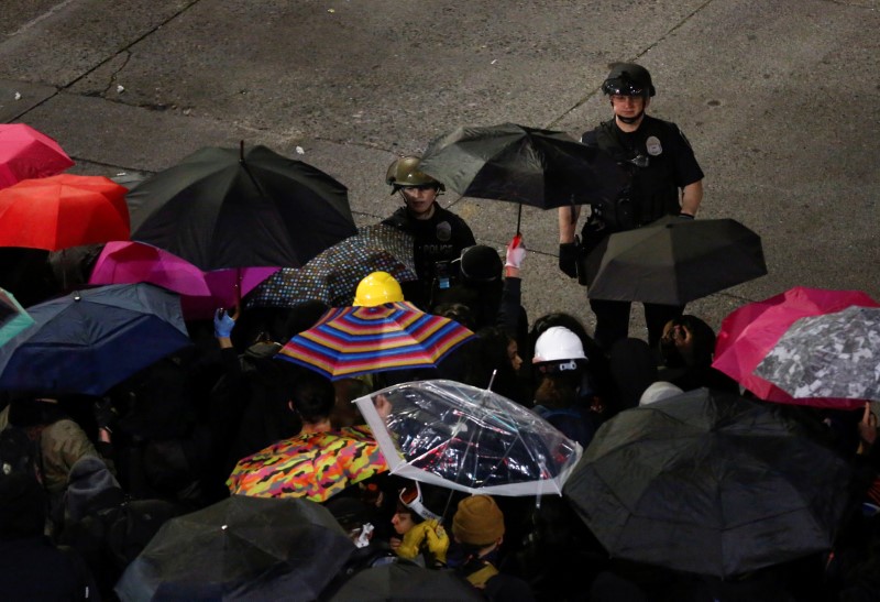 &copy; Reuters. Protesters rally following the death in Minneapolis police custody of George Floyd, near the department&apos;s East Precinct in Seattle