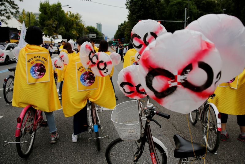 &copy; Reuters. FILE PHOTO: File picture of people taking part in a Global Climate Strike rally in Seoul,