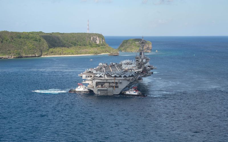 &copy; Reuters. The U.S. Navy aircraft carrier USS Theodore Roosevelt departs following an extended visit in the midst of a coronavirus disease outbreak in Guam