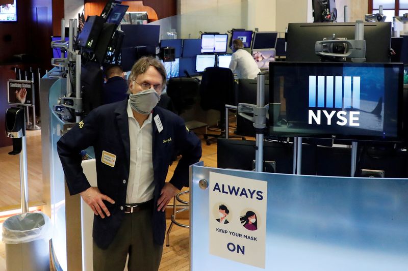 &copy; Reuters. FILE PHOTO: Traders on the floor of the New York Stock Exchange during the coronavirus outbreak, USA