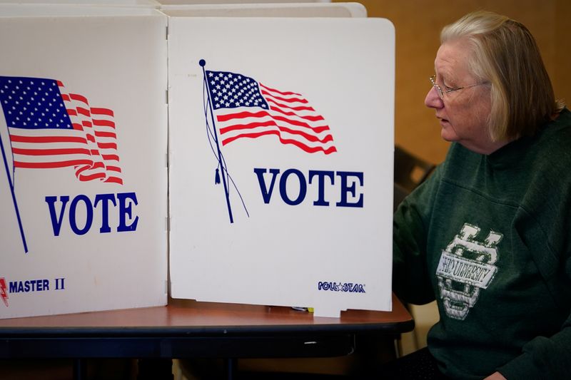 &copy; Reuters. A voters completes a paper ballot at the Butler County Board of Elections office in Hamilton