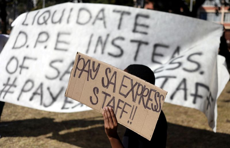 &copy; Reuters. FILE PHOTO: An employee of South African airline SA Express holds a placard during a demonstration in Pretoria