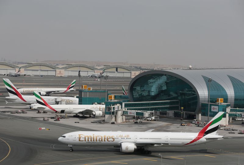 © Reuters. Emirates Airline planes are seen at Dubai International Airport in Dubai