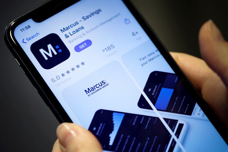 &copy; Reuters. FILE PHOTO: A woman looks at Marcus, a new savings and loans app recently launched by Goldman Sachs in New York