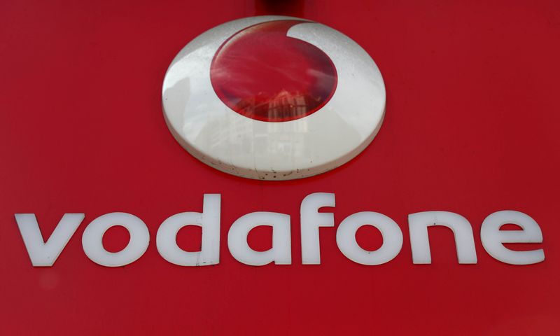 &copy; Reuters. FILE PHOTO: A branded sign is displayed on a Vodafone store in London