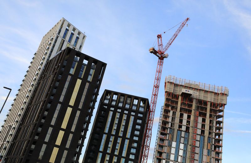 &copy; Reuters. A crane is seen above some high rise building construction works at Lewisham, in London