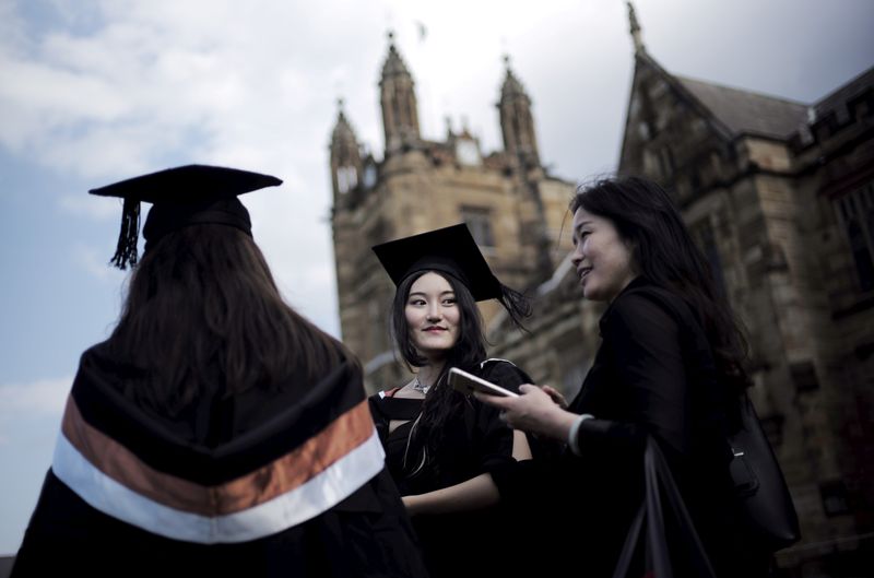 &copy; Reuters. FILE PHOTO: A university student wears her mortar hat following her graduation ceremony from the School of Commerce at the University of Sydney in Australia
