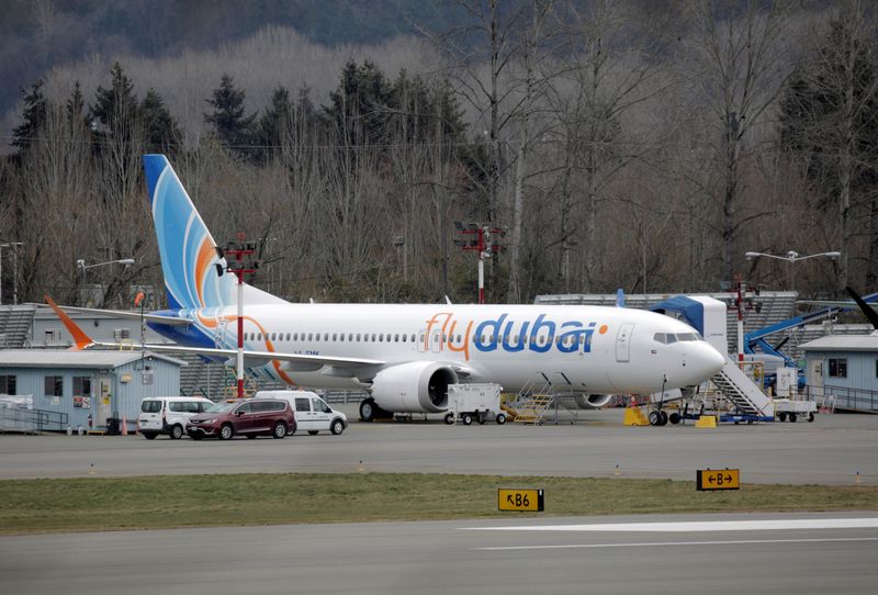 © Reuters. A Boeing 737 MAX aircraft bearing the logo of flydubai is parked at a Boeing production facility in Renton