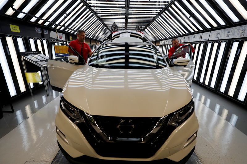 &copy; Reuters. Workers are seen on the production line at Nissan&apos;s car plant in Sunderland Britain