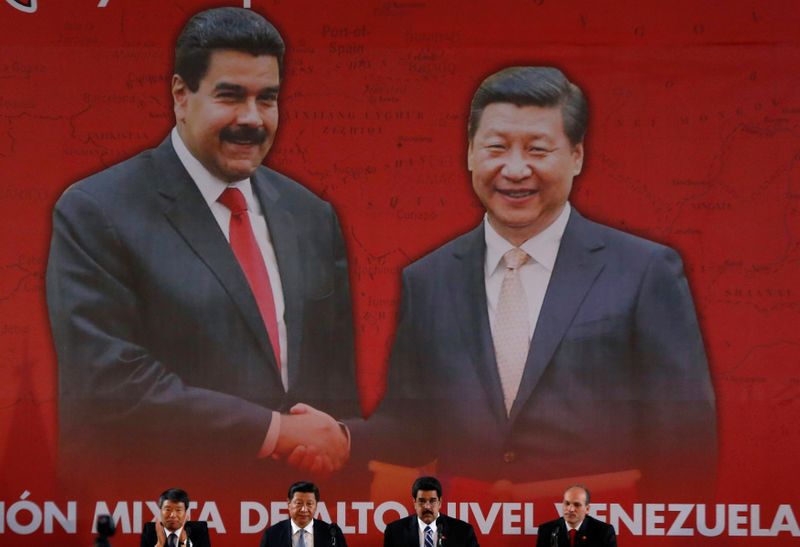 &copy; Reuters. FILE PHOTO: China&apos;s President Xi and Venezuela&apos;s President Maduro attend a signing ceremony in Caracas