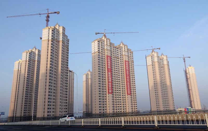 &copy; Reuters. FILE PHOTO: Residential buildings under construction are seen in Jinpu New District in Dalian, Liaoning