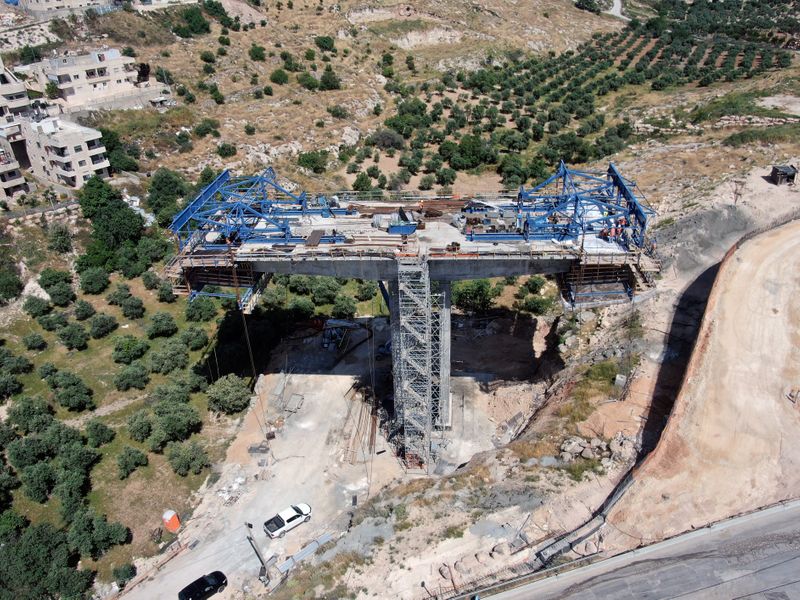 &copy; Reuters. An aerial view shows a bridge under construction as part of The American Road, an Israeli ring road that is being built through East Jerusalem. The construction is in Sur Baher, a Palestinian neighbourhood of East Jerusalem