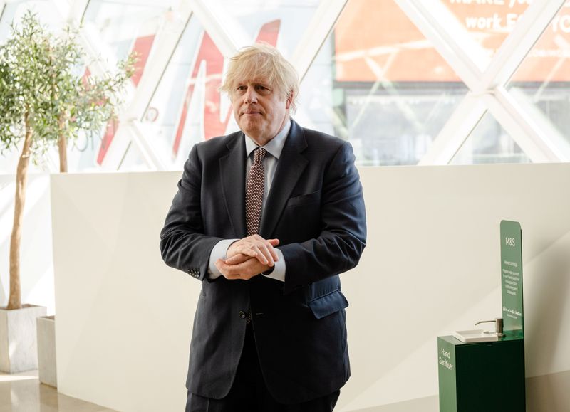 &copy; Reuters. Prime Minister Boris Johnson visits the M&amp;S clothing department and other retail outlets in Westfield Stratford, in London