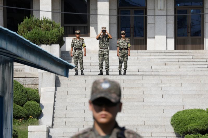 &copy; Reuters. North Korean soldiers patrol in the truce village of Panmunjom