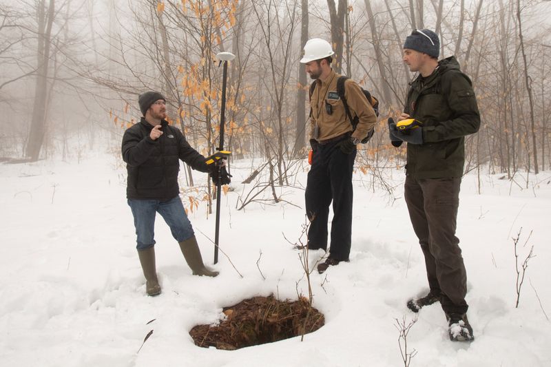 &copy; Reuters. Timothy De Smet, Nathan Graber and Alex Nikulin use a global navigation satellite system and geodetic antenna to locate an abandoned oil well in Olean, New York