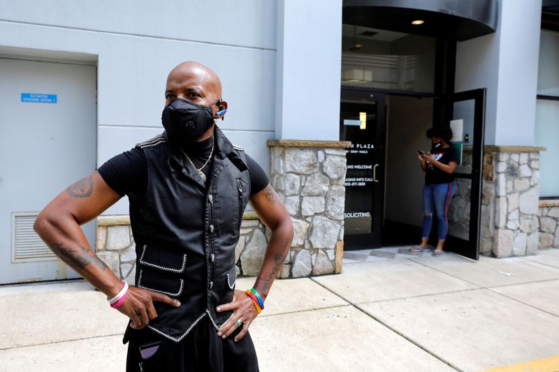 &copy; Reuters. Gary Connell talks about the economic impact to his hairstyling business after a nine-week disruption due to the stay-at-home order for the coronavirus disease (COVID-19) outbreak, outside at Salon Plaza in Wheaton, Maryland