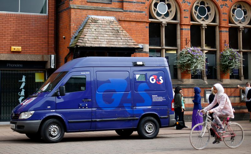 &copy; Reuters. A G4S security van is parked outside a bank in Loughborough