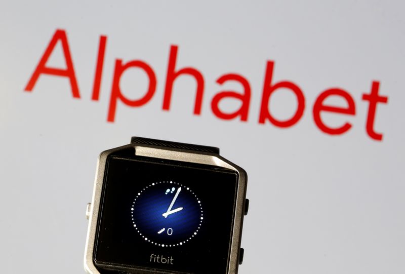 &copy; Reuters. Fitbit Blaze watch is seen in front of a displayed Alphabet logo in this illustration