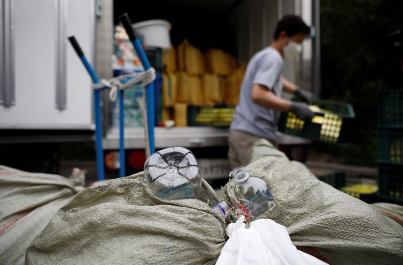 &copy; Reuters. North Korean defector group prepares plastic bottles filled with rice and masks to be sent towards North Korea