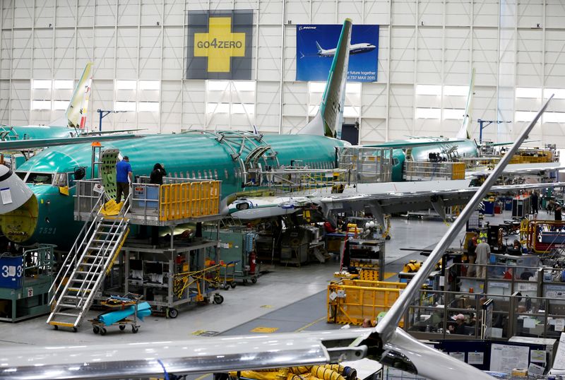 &copy; Reuters. FILE PHOTO: People work near the door of a 737 Max aircraft at the Boeing factory in Renton