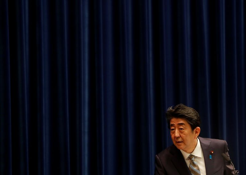 &copy; Reuters. Japan&apos;s Prime Minister Shinzo Abe listens to a question from a reporter at a news conference in Tokyo
