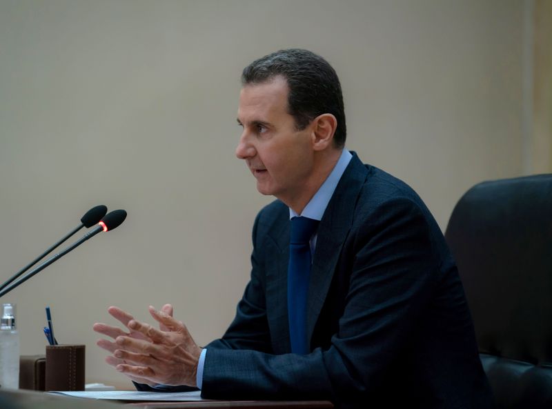 &copy; Reuters. Syrian President Bashar al-Assad addresses the government committee that oversees measures to curb the spread of the coronavirus disease (COVID-19), in Damascus
