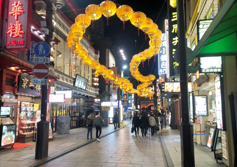 &copy; Reuters. Passersby are seen on a street in Yokohama’s China Town inn Yokohama, Japan