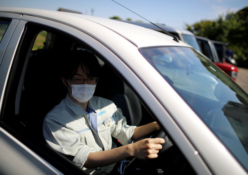 &copy; Reuters. Ryota Kawamata, 32-year old engineer of Sanko Manufacturing Co. is seen at the driver&apos;s seat of a car, in Saitama