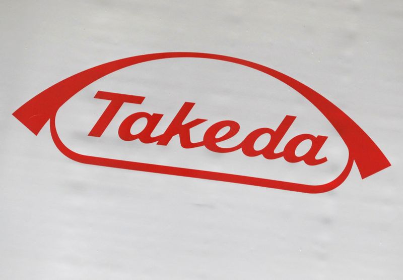 &copy; Reuters. FILE PHOTO: The logo of Takeda Pharmaceutical Co. is displayed at the company&apos;s news conference venue in Tokyo