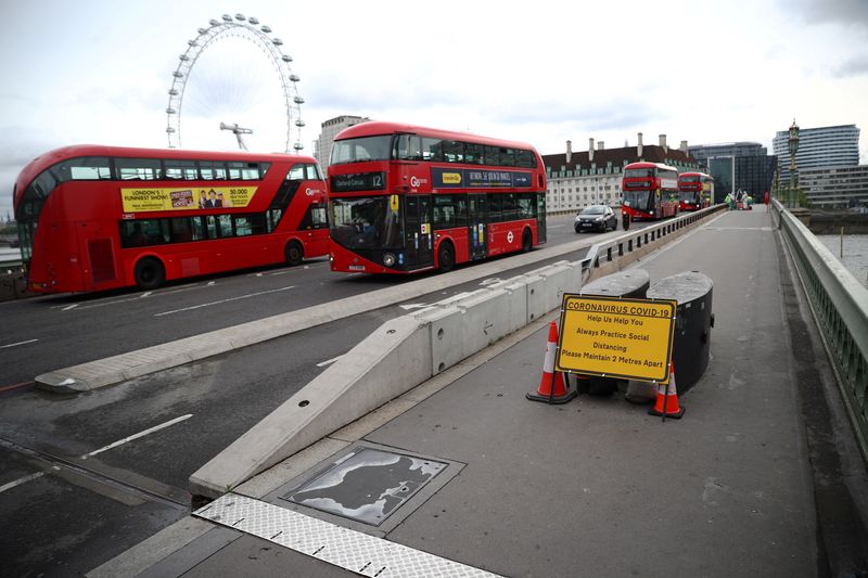 &copy; Reuters. A sign reminding people about social distancing is seen on Westminster bridge, as the outbreak of the coronavirus disease (COVID-19) continues, in London