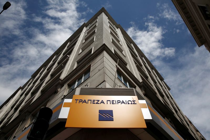 &copy; Reuters. FILE PHOTO: The logo of Piraeus Bank is seen outside a branch in Athens