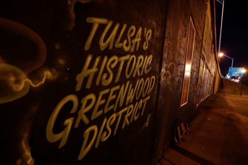 &copy; Reuters. A mural for the historic Greenwood district, known as the &quot;Black Wall Street&quot; is seen near U.S. President Donald Trump&apos;s upcoming rally venue at the BOK Center in Tulsa, Oklahom6