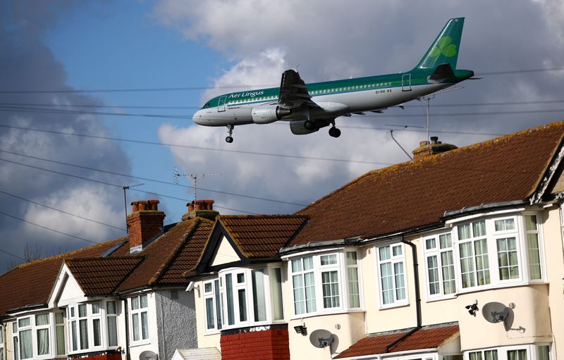 &copy; Reuters. An Aer Lingus passenger aircraft arrives over the top of residential houses to land at Heathrow Airport in west London