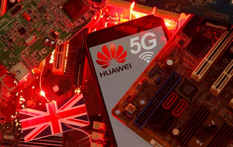 &copy; Reuters. FILE PHOTO: The British flag and a smartphone with a Huawei and 5G network logo are seen on a PC motherboard in this illustration