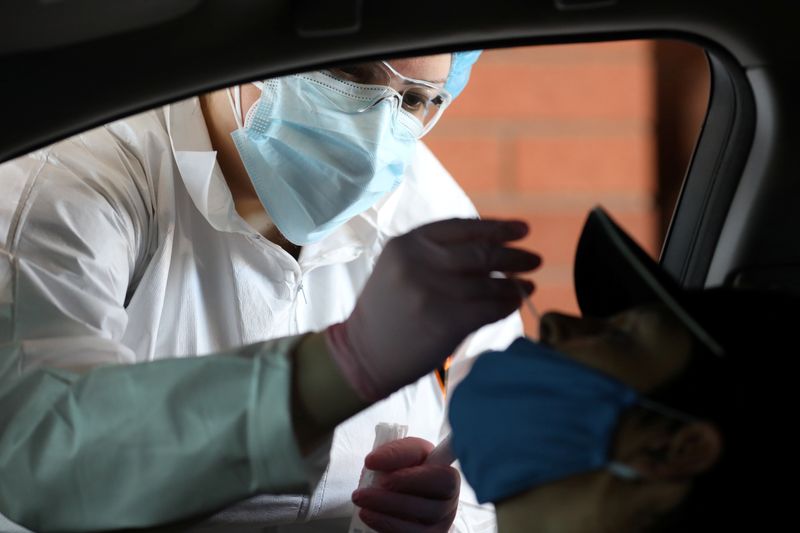 &copy; Reuters. Claudia Clemente, MA, performs a test for the coronavirus disease (COVID-19) as a part of Valle del Sol’s testing at Tolleson Fire Department Station 161 in Tolleson