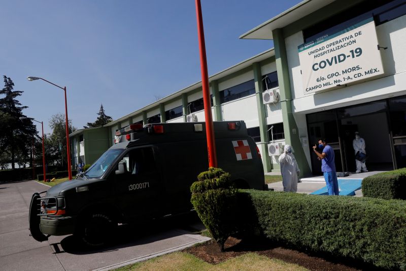 &copy; Reuters. FILE PHOTO:  A Doctor and a paramedic talk outside the provisional military hospital inside the Campo Militar No. 1, which takes care of patients with symptoms of the coronavirus disease (COVID-19) in Mexico City