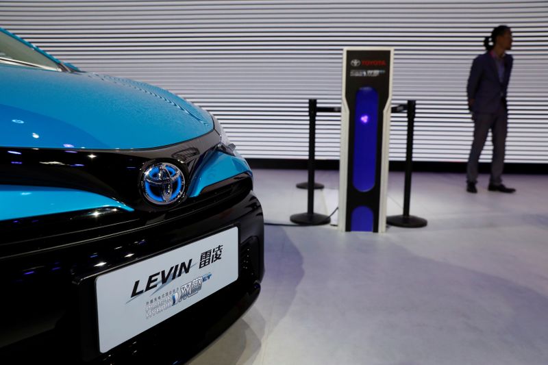 © Reuters. A Toyota Levin plug-in hybrid vehicle is displayed during a media preview of the Auto China 2018 motor show in Beijing