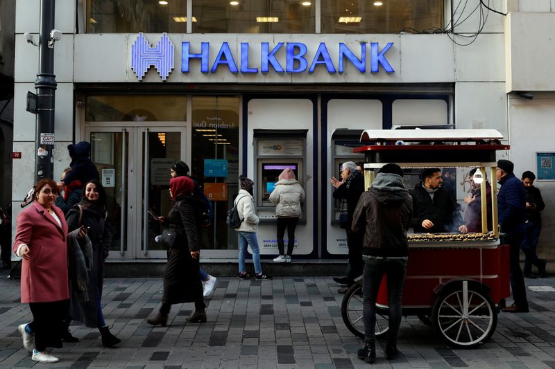 &copy; Reuters. People walk past by a branch of Halkbank in central Istanbul