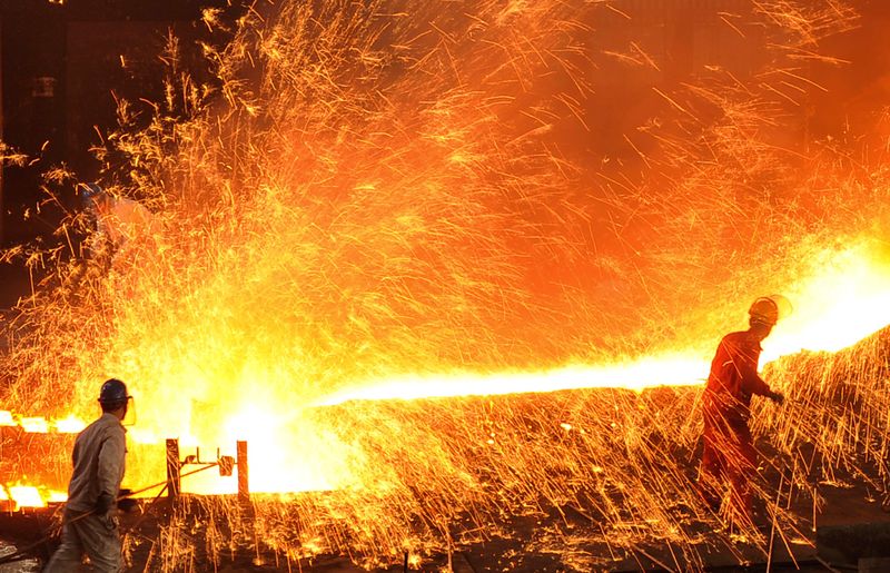 &copy; Reuters. Employees work at a factory of Dongbei Special Steel Group Co. Ltd. in Dalian