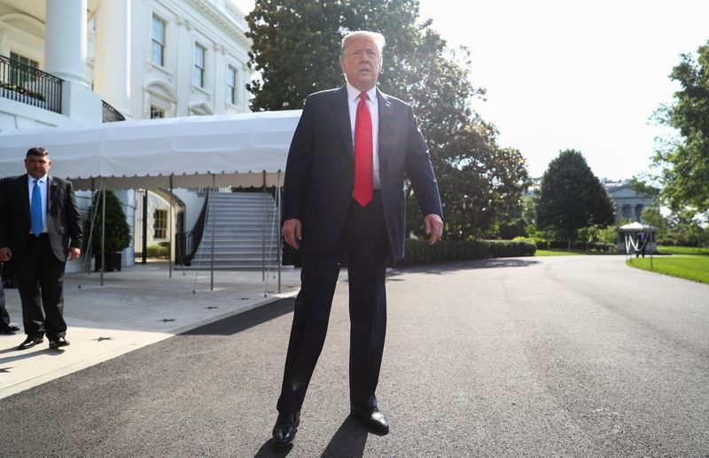 &copy; Reuters. President Trump talks to reporters as he departs for a trip to Arizona at the White House in Washington