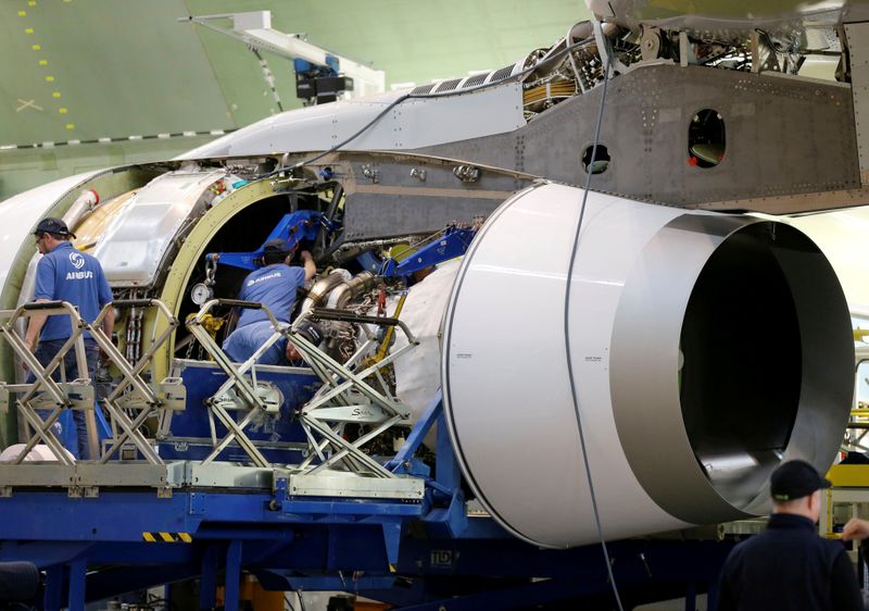 © Reuters. FILE PHOTO: Employees work on an engine of Airbus Beluga XL at the final assembly line at Airbus headquarters in Blagnac, near Toulouse