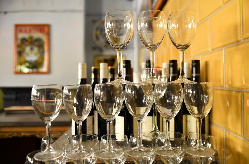© Reuters. FILE PHOTO: Wine glasses are stacked inside The Greenwich Pensioner pub in London