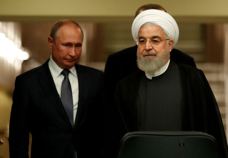 &copy; Reuters. FILE PHOTO: Presidents Rouhani of Iran and Putin of Russia arrive for a news conference in Ankara