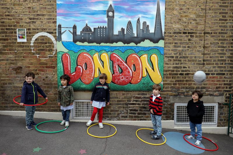&copy; Reuters. Children use hoops for social distancing at L&apos;Ecole Des Petits school